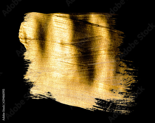 Creative brushstrokes of gold paint isolated on a black background. Gold paint texture.Acrylic gold paint. Smears of cosmetics, blush, highlighter, eye shadow, lipstick.