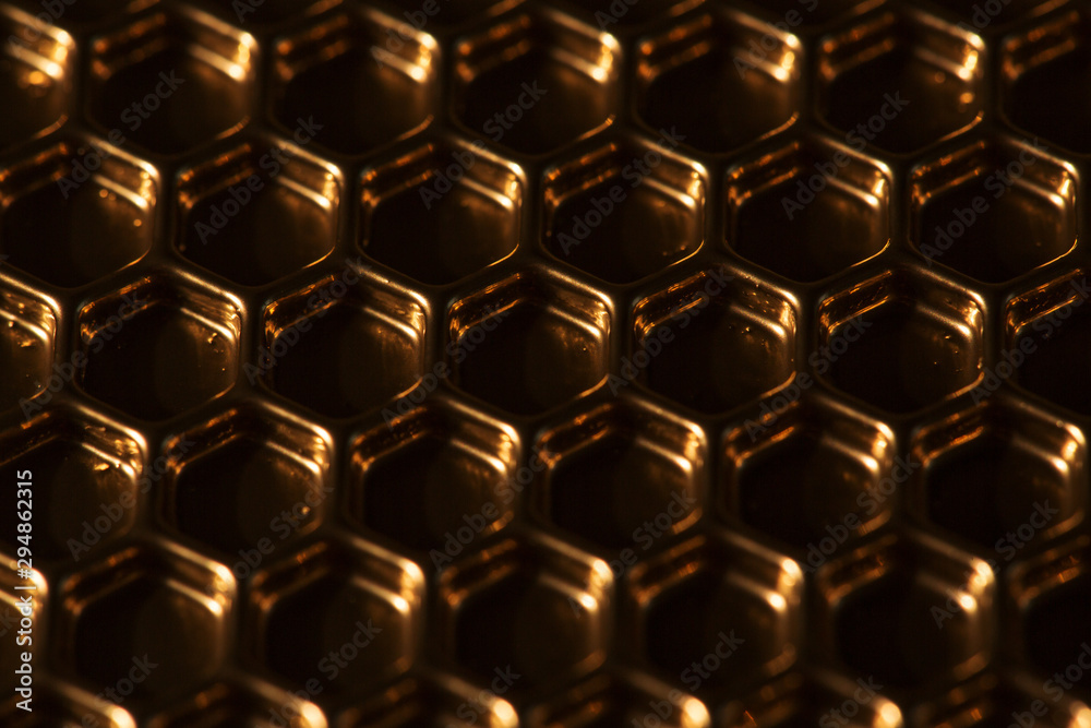 Abstract hexagon background. Hexagons industrial background. Golden bee honeycombs. Abstract hexagon background. Hexagons industrial background. Golden bee honeycombs.