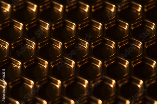 Abstract hexagon background. Hexagons industrial background. Golden bee honeycombs.