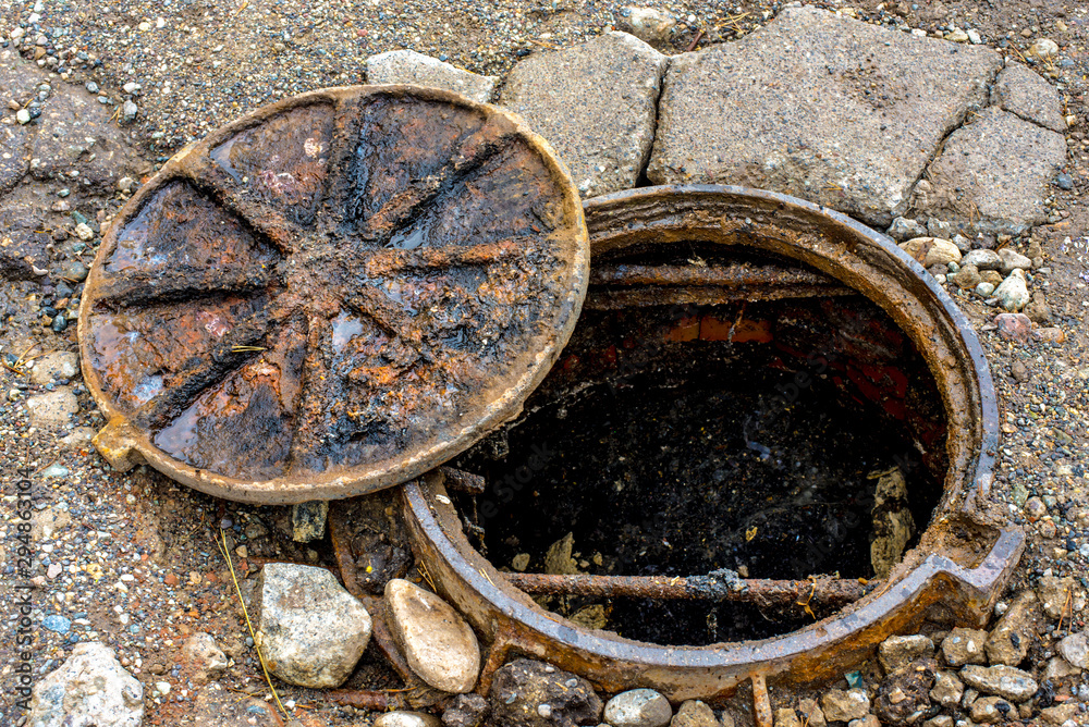 old rusty open sewer manhole, danger Stock Photo | Adobe Stock