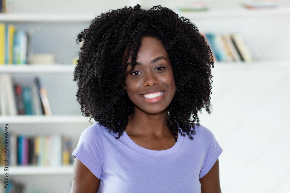 Fototapeta premium Beautiful african american woman looking at camera
