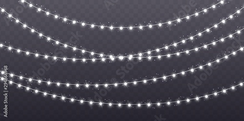 Christmas garland isolated on transparent background. Glowing white light bulbs with sparkles. Xmas, New Year, wedding or Birthday decor. Party event decoration. Winter holiday season element.