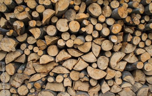 Firewood texture. Wooden sticks lie on top of each other.