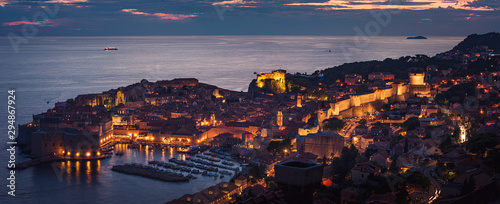 Beautiful high angle panoramic view of the old port and town of Dubrovnik after sunset. Travel destination Croatia 