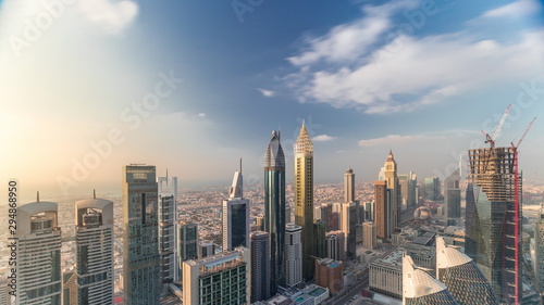 Skyline view of the buildings of Sheikh Zayed Road and DIFC aerial timelapse in Dubai, UAE. © neiezhmakov