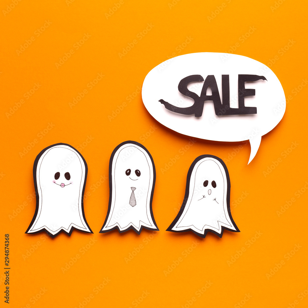 Obraz premium Happy ghosts predicting Halloween sales in speech bubble