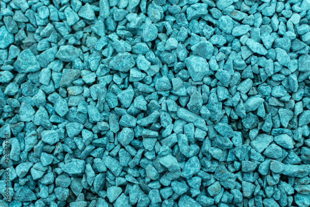 Stack of underwater pebbles. Blue background, texture, pattern Stack of underwater pebbles. Blue background, texture, pattern