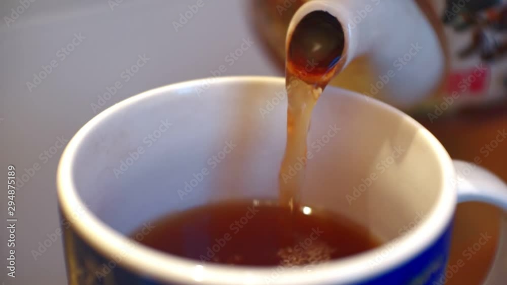 poured from a teapot into a cup of tea.close-up.shallow depth of field poured from a teapot into a cup of tea.close-up.shallow depth of field