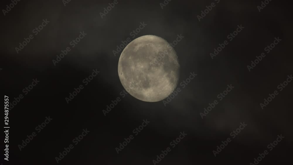 Detailed almost full moon close up behind dark slow moving clouds.mov Detailed almost full moon close up behind dark slow moving clouds.mov