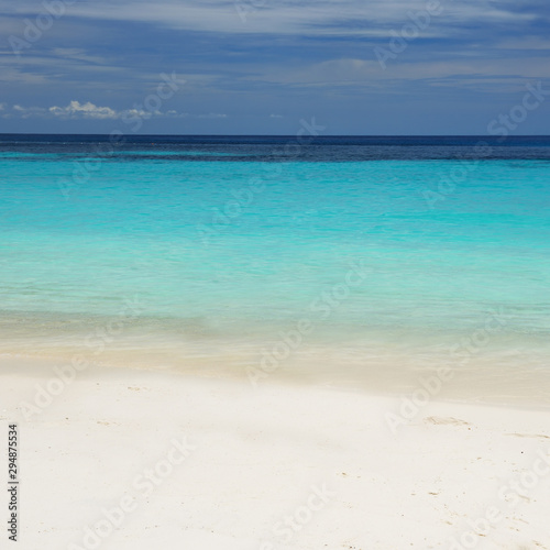 Ocean background with white beach sand