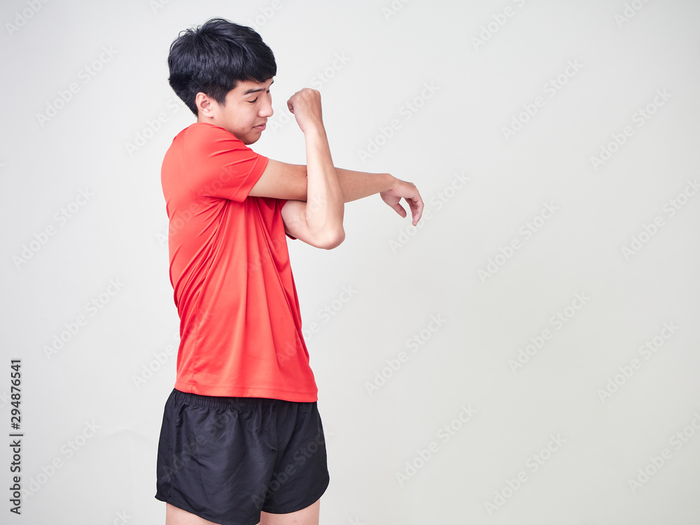 Young man sports player stretching and exercising Young man sports player stretching and exercising