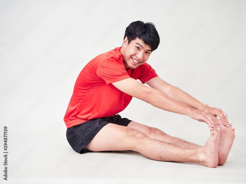 Young man sports player stretching and exercising Young man sports player stretching and exercising