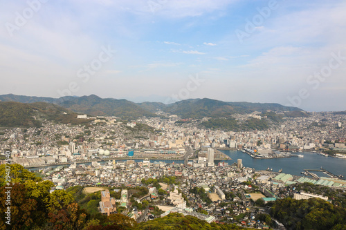 Landscape view of top Mount Inasa in sunny day with Nagasaki city and blue sky and mountain © Lapapas