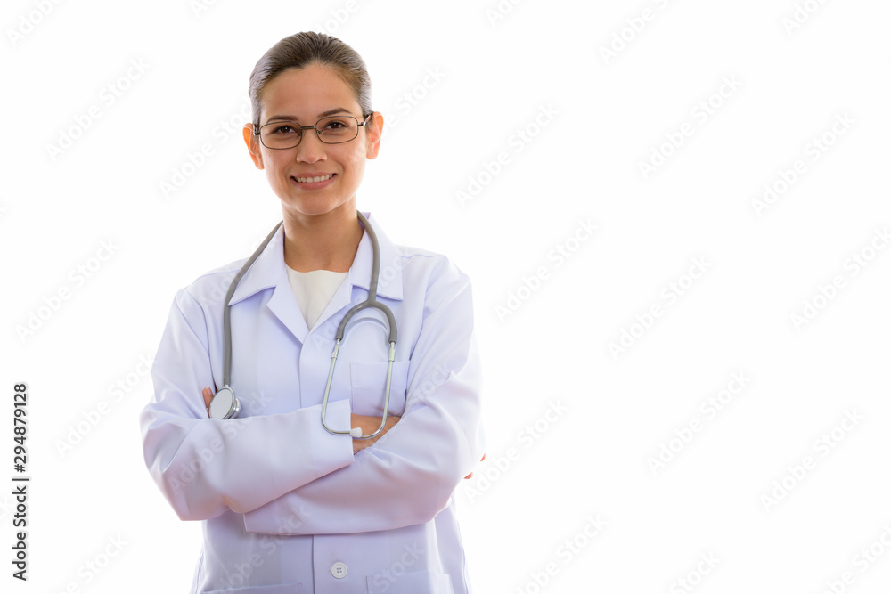 Studio shot of young happy woman doctor smiling while wearing ey Studio shot of young happy woman doctor smiling while wearing ey
