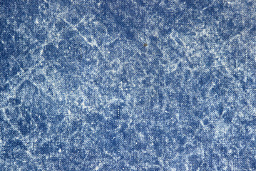 Texture of a blue stone-washed denim fabric