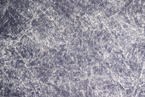 Texture of a gray stone-washed denim fabric