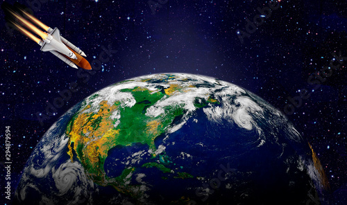 Space shuttle launch in the open space over the Earth. Elements of this image furnished by NASA