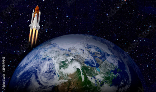 Space shuttle launch in the open space over the Earth. Elements of this image furnished by NASA