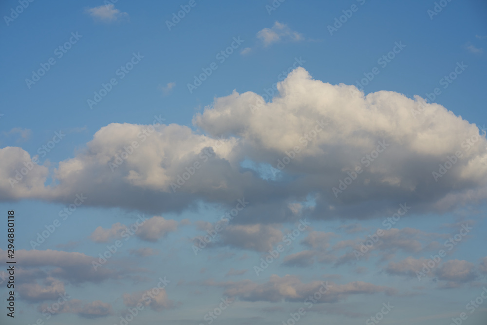 beautiful white cloud formation in bright blue sky as background