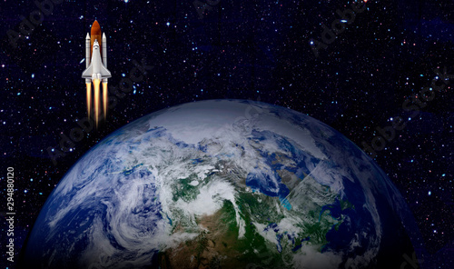 Space shuttle launch in the open space over the Earth. Elements of this image furnished by NASA