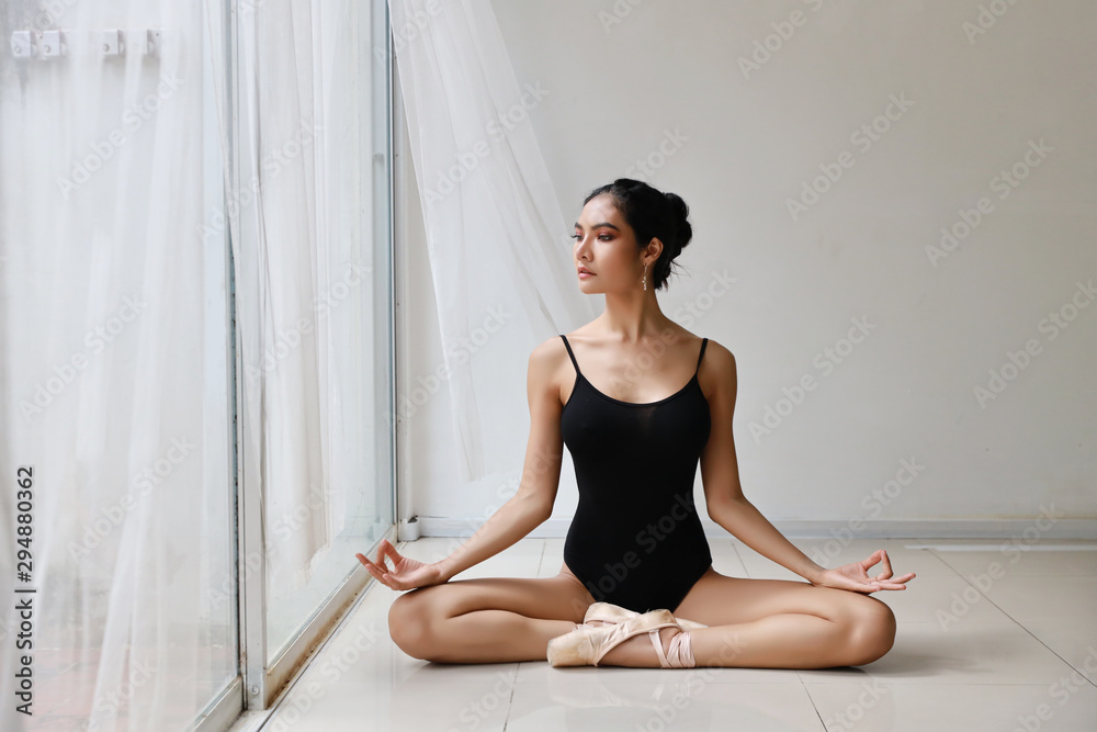 beautiful healthy asian woman in ballet dress enjoying in meditates with yoga pose at home with relaxation beautiful healthy asian woman in ballet dress enjoying in meditates with yoga pose at home with relaxation