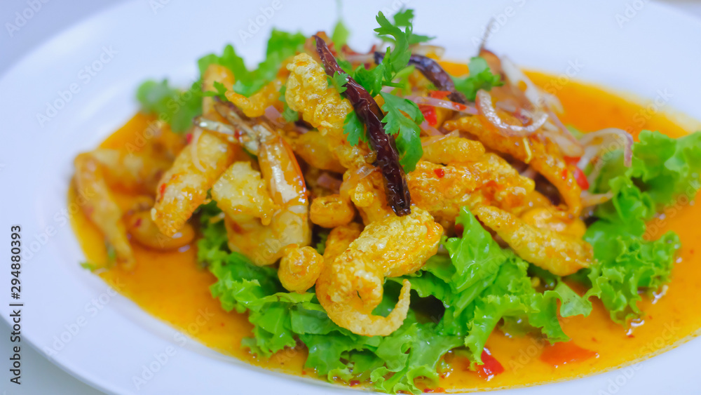 Close up Crispy Fish Maw in Spicy Salad with vegetable on white dish, thai food. Close up Crispy Fish Maw in Spicy Salad with vegetable on white dish, thai food.