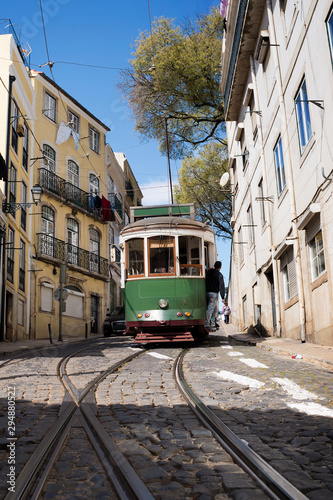 Tourist green tram riding around Bairro Alto neighborhood, Lisbon, Portugal 