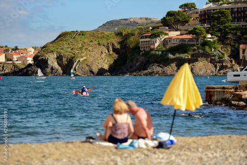 Young couple kayaking on the beautiful beach of Coliure, France. photo