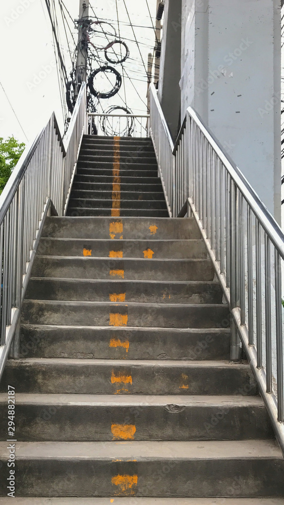 Close up step up concrete stairs of the overpass or footbridge in Thailand. Close up step up concrete stairs of the overpass or footbridge in Thailand.