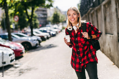 Young skater girl posing with coffee © JustLife
