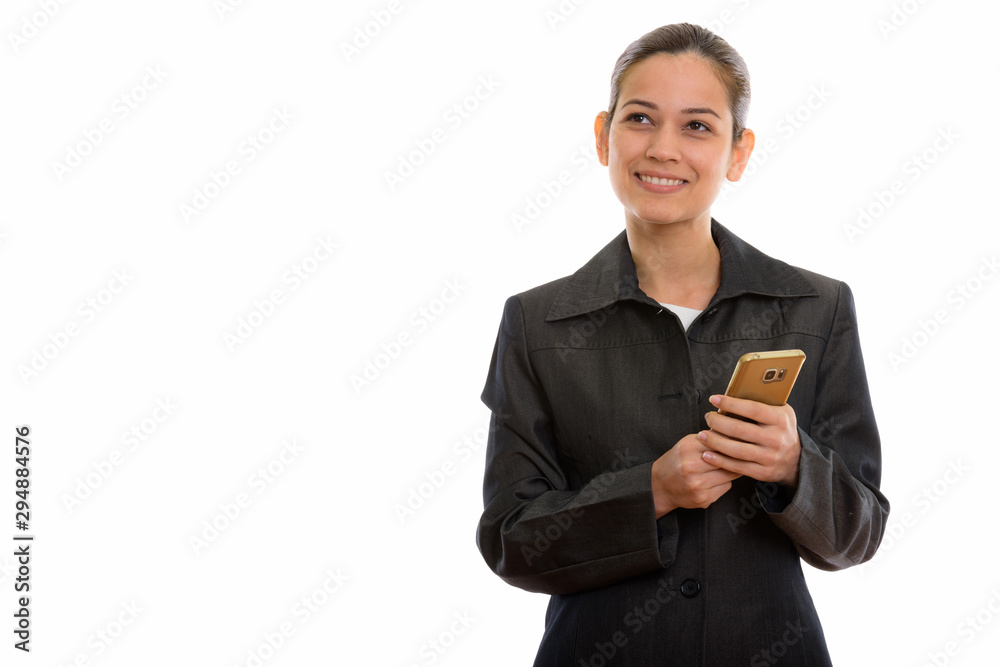 Studio shot of young beautiful businesswoman holding mobile phon Studio shot of young beautiful businesswoman holding mobile phon