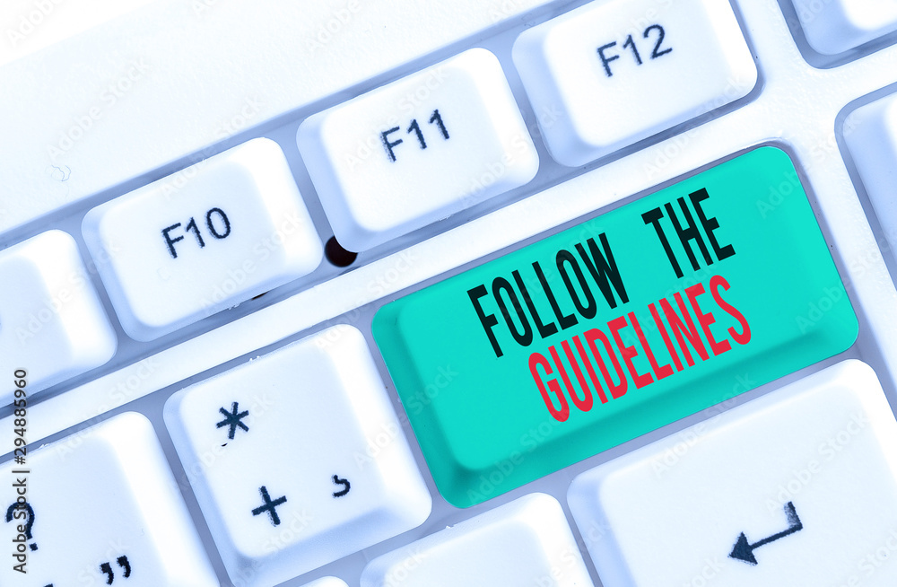 Text sign showing Follow The Guidelines. Business photo text Manual of Style Follow a Specified Rule Accordingly White pc keyboard with empty note paper above white background key copy space Text sign showing Follow The Guidelines. Business photo text Manual of Style Follow a Specified Rule Accordingly White pc keyboard with empty note paper above white background key copy space