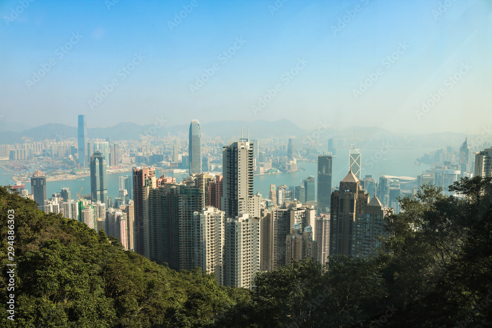 Hong Kong city skyline from the Victoria peak with blue sky