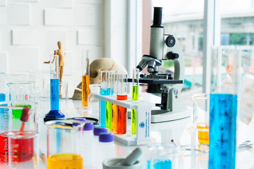 science research laboratory concept . Equipment in science laboratory Glassware containing chemical liquid for experiments and microscope science research laboratory concept . Equipment in science laboratory Glassware containing chemical liquid for experiments and microscope