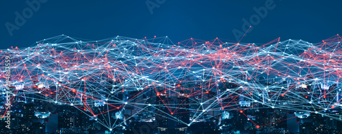 Smart city and Wireless communication network concept.abstract line connection on night city background.IoT(Internet of Things). ICT(Information Communication.