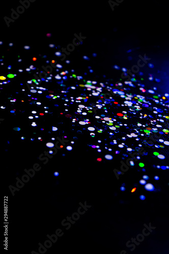 Colorful lights blurred glitter background. Abstract illuminated texture. Christmas  new year or birthday celebration. Night life photography