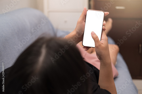 A women touch smart phone with blank screen. Mockup screen. Clipping path.