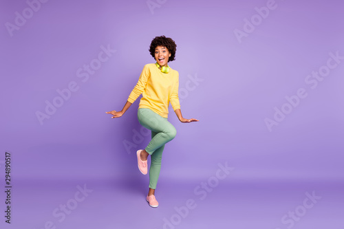 Full length body size view of her she nice attractive charming lovely funny funky girlish cheerful cheery wavy-haired girl dancing having fun isolated over violet purple lilac pastel color background