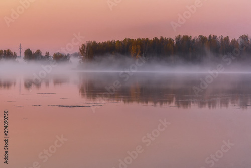 morning dawn on the river with fog over the water