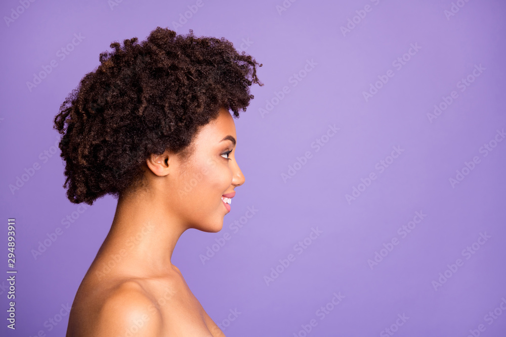 Photo of trendy wavy cheerful beautiful girl standing naked side profile looking into empty space isolated over purple pastel color background Photo of trendy wavy cheerful beautiful girl standing naked side profile looking into empty space isolated over purple pastel color background