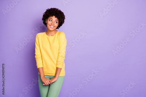 Portrait of her she nice attractive charming lovely cute winsome girlish cheerful cheery shy wavy-haired girl posing looking aside isolated over violet purple lilac pastel color background