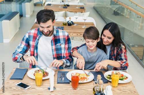 Family Sitting Together in the Restaurant Lunch Concept