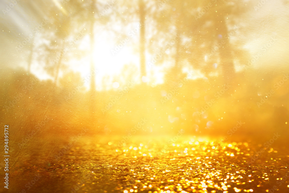 concept background photo of light burst among trees and glitter golden bokeh sparkles concept background photo of light burst among trees and glitter golden bokeh sparkles