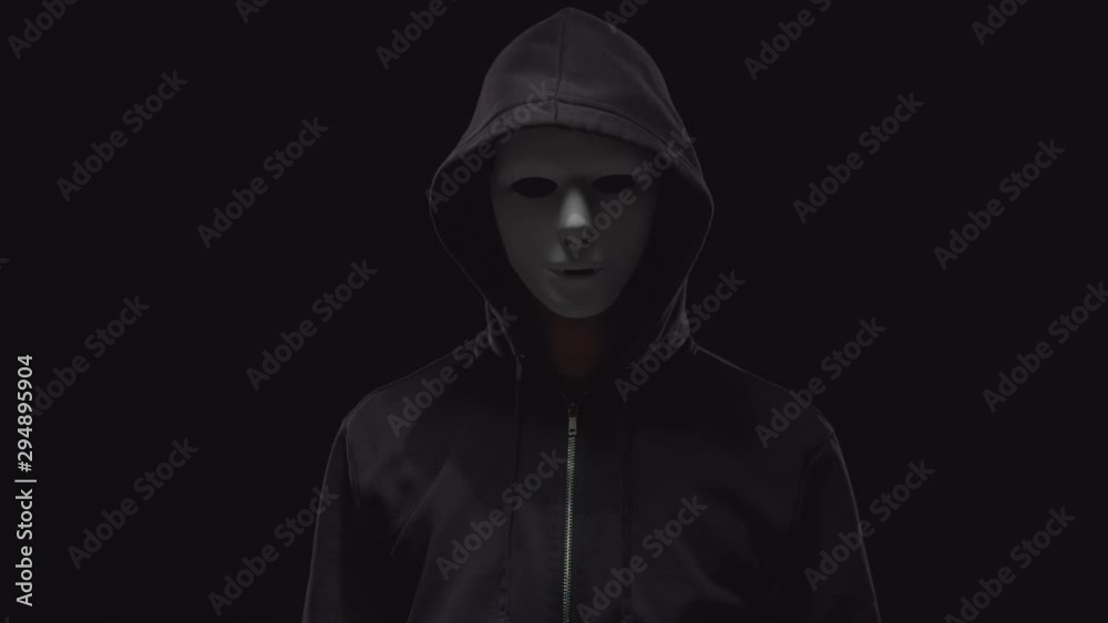 Portrait of computer hacker in hoodie. Obscured dark face. Data thief, internet fraud, darknet and cyber security . Portrait of computer hacker in hoodie. Obscured dark face. Data thief, internet fraud, darknet and cyber security .