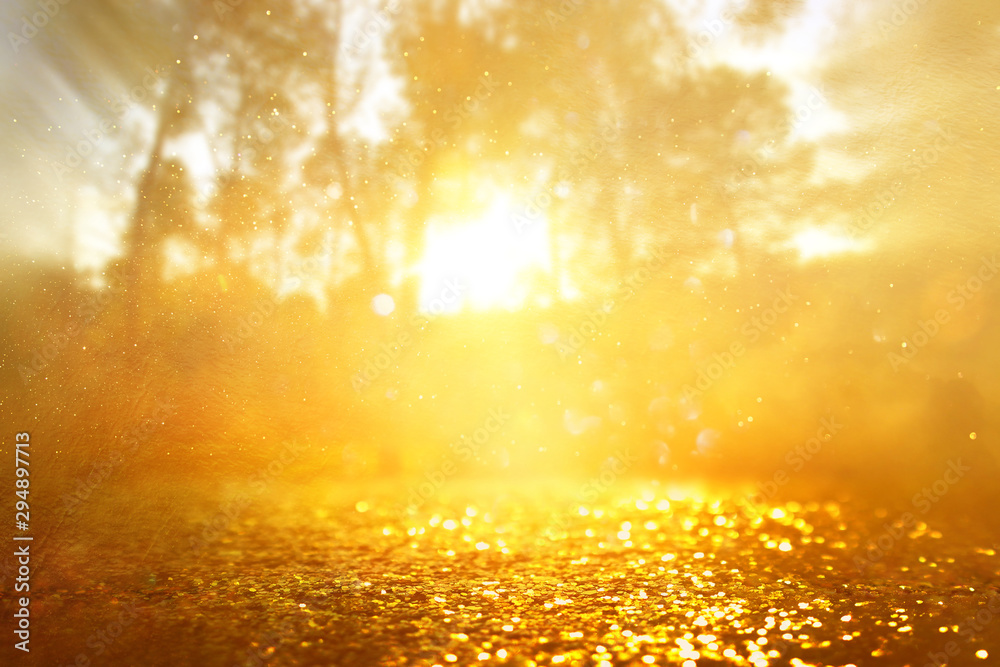 concept background photo of light burst among trees and glitter golden bokeh sparkles concept background photo of light burst among trees and glitter golden bokeh sparkles