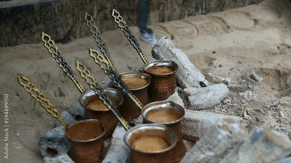 Cooking Turkish Coffee on Sand as Double Shots Cooking Turkish Coffee on Sand as Double Shots