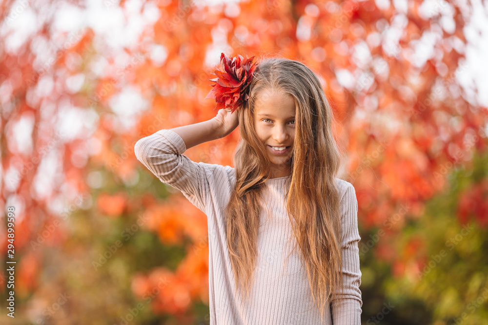 Portrait of adorable little girl with yellow leaves bouquet in fall Portrait of adorable little girl with yellow leaves bouquet in fall