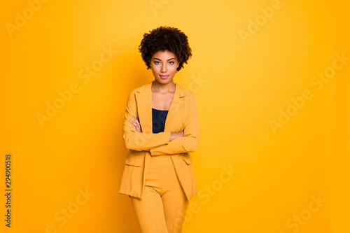Portrait of her she nice-looking attractive charming pretty calm content wavy-haired girl folded arms summer clothing trend isolated over bright vivid shine vibrant yellow color background