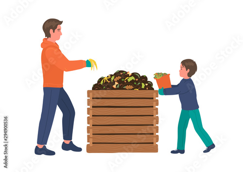 Composting. Man with boy making compost. Recycling concept. 