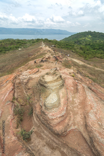 Tourists walking hiking trekking tour trail to Taal volcano, Batangas, Philippines photo